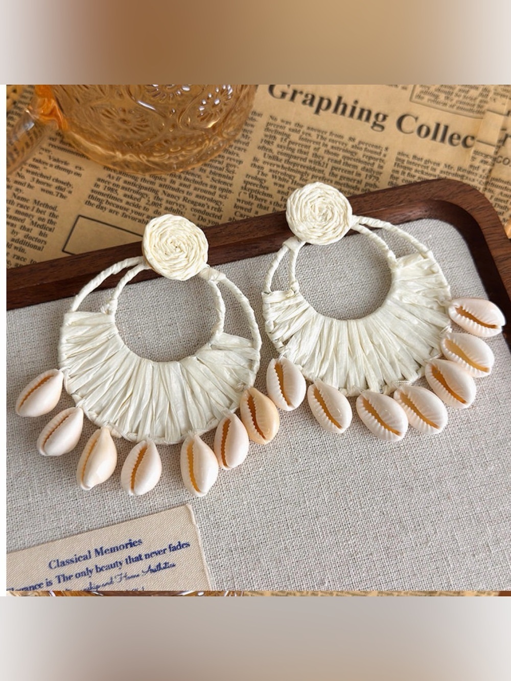 A Classy Chic Boutique Cream Raffia Hoop Earrings with Cowrie Shells